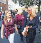  ??  ?? Jaclyn Corin, 17, who survived the shooting in Parkland, Fla., marches with state Sen. Lauren Book last month. LUKE FRANKE/NAPLES DAILY NEWS