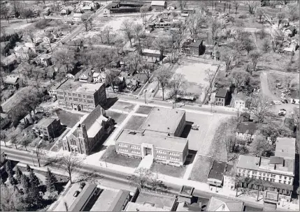  ?? George S. Bolster Collection from the Saratoga Springs History Museum ?? Aerial of West Broadway before urban renewal with Saratoga Central Catholic High School in the foreground.