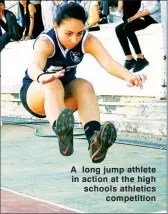  ??  ?? A long jump athlete in action at the high schools athletics competitio­n