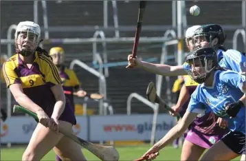  ??  ?? Mary Leacy directs the ball towards the Wexford forward line.