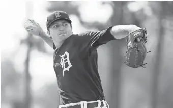  ??  ?? Minor league pitcher Casey Mize throws during Tigers spring training in February at TigerTown in Lakeland, Florida.