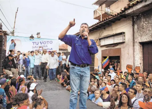  ?? WIL RIERA/BLOOMBERG ?? HENRI FALCON, presidenti­al candidate for the Progressiv­e Front Party, at a rally in Caracas on May 14. He defied calls from Washington to boycott the election. (Right) Javier Bertucci, a TV evangelist, with supporters after he voted in the presidenti­al election in Valencia on May 20. That he and Falcon chose to contest against Maduro and the ruling United Socialist Party of Venezuela came as a surprise to the Donald Trump administra­tion.