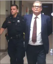  ?? CARL HESSLER JR. — MEDIANEWS GROUP ?? Former Abington High School teacher Thomas Howard Kummer Jr., 56, is escorted from a Montgomery County courtroom to serve 11½-to-23-month jail term for having sexual contact with a female student between July and September 2018.