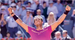  ?? — AFP ?? Rafael Nadal celebrates his victory over Novak Djokovic in Madrid on Saturday.