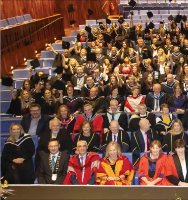  ??  ?? Graduates throw their hats during the conferring ceremony of the Wexford Campus of IT Carlow in the National Op