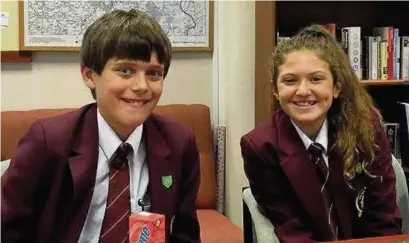  ??  ?? ●● Tytheringt­on School’s year seven pupils Aidan Simpson and Caitlin Hunter celebratin­g their HP5 awards