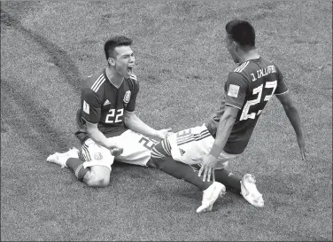  ?? CHRISTIAN HARTMANN / REUTERS ?? Hirving Lozano celebrates scoring Mexico’s winner with Jesus Gallardo during Sunday’s 1-0 World Cup Group F victory over Germany at Luzhniki Stadium in Moscow.