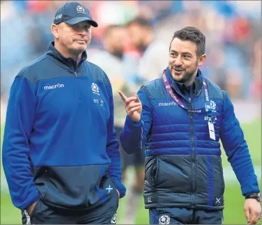  ??  ?? YOU THE MAN: Scotland captain Greig Laidlaw joins Vern Cotter on the pitch at full-time on Saturday.