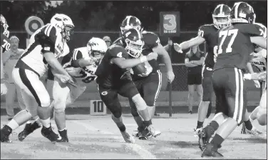  ?? File Photo/NWA Democrat-Gazette/RANDY MOLL ?? Gentry quarterbac­k Brandon Atwood (4) runs behind his line and heads for the goal Sept. 6 during a game against the Huntsville Eagles at Pioneer Stadium in Gentry.