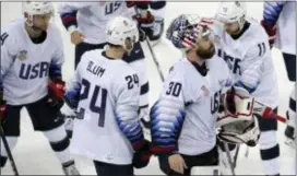  ?? JULIO CORTEZ — THE ASSOCIATED PRESS ?? The United States players react after the preliminar­y round of the men’s hockey game against the team from Russia at the 2018 Winter Olympics in Gangneung, South Korea, Saturday. Olympic Athletes from Russia won 4-0.