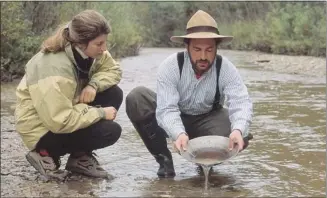  ?? Photos courtesy, Yukon Government ?? The lure of gold drove more than a few gold panners to get their feet wet in pursuit of fortune.