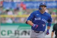  ?? ?? Toronto Blue Jays’ Joey Votto circles the bases after hitting a solo home run off Philadelph­ia Phillies starter Zack Wheeler during the first inning of a spring training baseball game Sunday, March 17, 2024, in Clearwater, Fla. (Steve Nesius/The Canadian Press via AP)