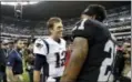  ?? REBECCA BLACKWELL — THE ASSOCIATED PRESS ?? New England Patriots quarterbac­k TomBrady, left, talkswith Oakland Raiders cornerback Sean Smith, right, after an NFL football game Sunday in Mexico City.