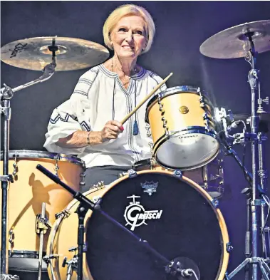  ??  ?? Mary Berry, 83, plays the drums after joining Rick Astley, 52, on stage at Camp Bestival in the grounds of Lulworth Castle, Wareham, Dorset. The Never Gonna Give You Up singer, who recently made a comeback 23 years after retiring, was the headline act...