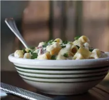  ??  ?? SAY CHEESE: Tidbits of corned beef are nestled in a dish of pasta with a cheese sauce.