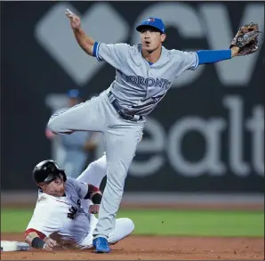  ?? AP PHOTO/CHARLES KRUPA ?? Toronto Blue Jays third baseman Darwin Barney watches his throw after he forced out Boston Red Sox's Christian Vazquez during the fifth inning of a baseball game at Fenway Park in Boston, Monday.