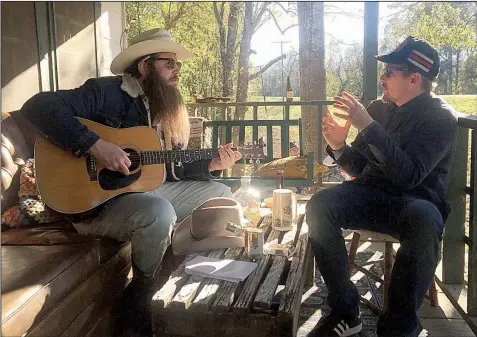  ??  ?? Ben Dickey, in costume as ill-starred singer-songwriter Blaze Foley, listens to director Ethan Hawke on the set of Blaze.