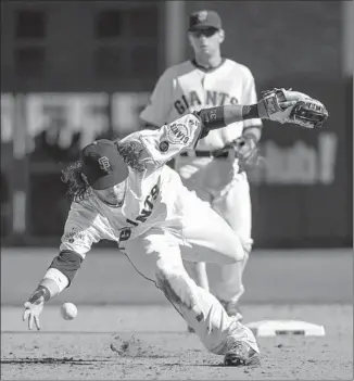  ?? Jose Luis Villegas
Associated Press ?? SHORTSTOP BRANDON CRAWFORD, front, is batting .200 and is among several struggling hitters for the San Francisco Giants, who have lost nine of their last 10 games.