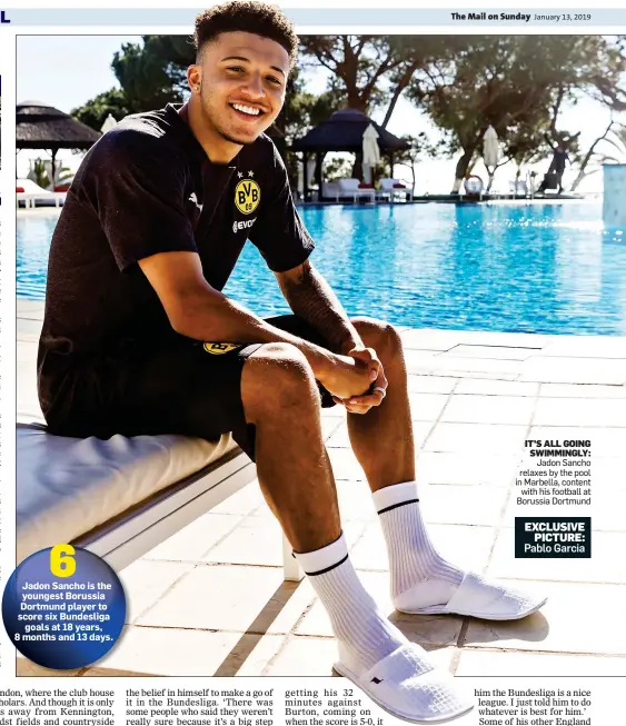  ??  ?? IT’S ALL GOING SWIMMINGLY: Jadon Sancho relaxes by the pool in Marbella, content with his football at Borussia Dortmund
