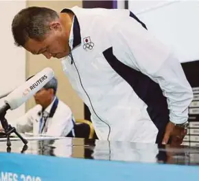  ?? AFP PIC ?? Japan’s chef de mission Yasuhiro Yamashita bows in apology during a press conference yesterday.