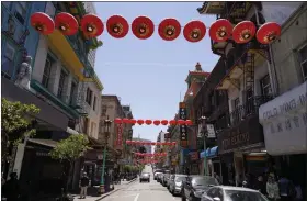  ?? AP ?? Lanterns hang in Chinatown above Grant Avenue in San Francisco, on May 23. Chinatowns and other Asian American enclaves across the U.S. are using art and culture to show they are safe and vibrant hubs nearly three years after the start of the pandemic.