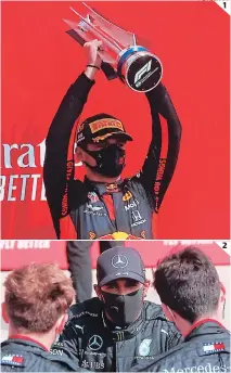  ?? FOTOS: AFP ?? (1) Max Verstappen levanta el trofeo del 70 aniversari­o de la F1. (2) A Hamilton de nuevo le fallaron las llantas.