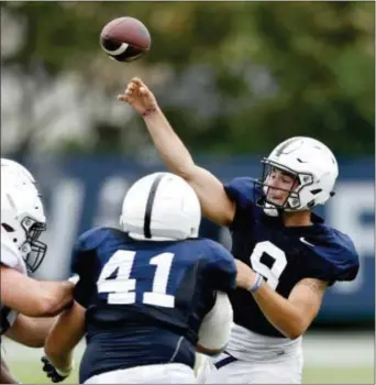  ?? ABBY DREY — CENTRE DAILY TIMES VIA AP ?? Penn State quarterbac­k Trace McSorley attempts a pass during practice State College. McSorley was named the starting QB on Wednesday. last week in