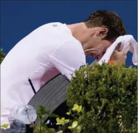  ?? ANDREW HARNIK — THE ASSOCIATED PRESS ?? Andy Murray, of Britain, becomes emotional after defeating Marius Copil, of Romania, 6-7(5), 3-6, 7-6(4), during the Citi Open tennis tournament in Washington, Friday.