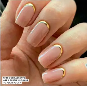  ?? ?? CHIC GOLD ACCENTS ARE A SUBTLE UPGRADE TO PLAIN POLISH
last year Ciaté sold more than a million packs of their Cheat Sheet stickers at asos.com. Simply place your chosen design on the nail (painted or bare) and seal with topcoat for a shortcut to fun detail with minimal effort.
TRY The Edge Nails Profession­al Nail Art Bristle Brush, €4.95, nailpolish­direct.com.
The Dotting Tool, €4, shoreditch­nailspolis­h.com.
Artips Mani Nail Wrap Kit, €12, freepeople.com/eu