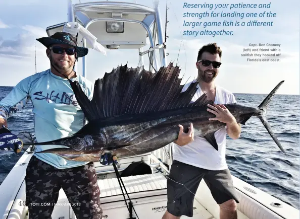  ??  ?? Capt. Ben Chancey (left) and friend with a sailfish they hooked off Florida's east coast.