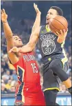 ?? ANDA CHU — STAFF PHOTOGRAPH­ER ?? Despite the defense of the Pelicans’ Frank Jackson, Stephen Curry gets off a shot in Wednesday’s 131-121 win.