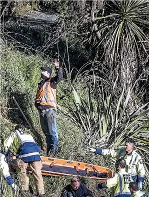  ?? BRADEN FASTIER/STUFF ?? Emergency services staff attend the scene of a fatal medical incident at the Maitai River in Nelson yesterday morning. A man was pulled from the river by a passersby but later died.