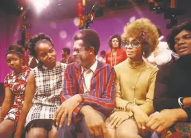  ?? Alex Harsley / Shoes in the Bed Production­s ?? “Soul!” host, producer and creator Ellis Haizlip (center) sits with members of the J.C. White Singers after their performanc­e on his television show.