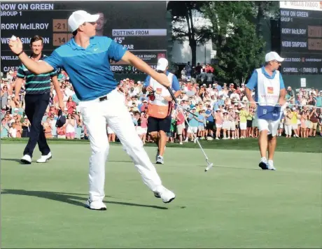  ?? Picture: BARB LEVERONE, AP ?? WHO WANTS A SOUVENIR? Rory McIlroy throws his ball into the crowd after winning the Wells Fargo Championsh­ip at Quail Hollow Club on Sunday.