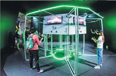  ?? PHOTOS PROVIDED TO CHINA DAILY ?? Audiences watch VR films at the recent Sandbox Immersive Festival, China’s first immersive media festival, in Qingdao, Shandong province in June.