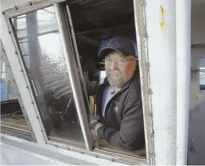  ?? AP PHOTO ?? OcEAN OBSTAclES: Scallop fisherman Eric Hansen is among those wary of wind-turbine developmen­t off the New Bedford coast, saying navigating boats through wind farms will be `next to impossible.'