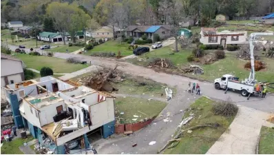  ?? The Associated Press ?? ■ A drone image show the damage to Trish Partridge’s house, at lef,t and James Dunaway’s home, at right, following a day of extended severe weather on Friday in Pelham, Ala.