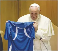  ?? ASSOCIATED PRESS FILES ?? Pope Francis is hoping a charity soccer match that includes Swiss Guards, Vatican employees, priests, a player with Down syndrome, migrants and members of the Roma community will deal a significan­t “kick” against discrimina­tion
