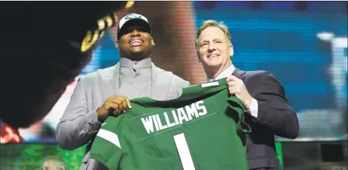  ?? Mark Humphrey / Associated Press ?? Alabama defensive tackle Quinnen Williams poses with NFL Commission­er Roger Goodell after the New York Jets selected Williams in the first round at the NFL draft on Thursday in Nashville, Tenn.