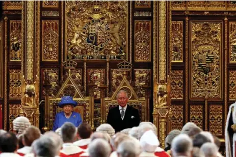 ?? STEFAN WERMUTH/AFP/GETTY IMAGES ?? Queen Elizabeth II sits alongside her son Prince Charles during the State Opening of Parliament in the Houses of Parliament on Wednesday.