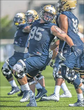  ?? Andrew Stein/Post-Gazette ?? Devin Danielson works on a move in a drill for defensive linemen on Day 2 of Pitt’s camp.