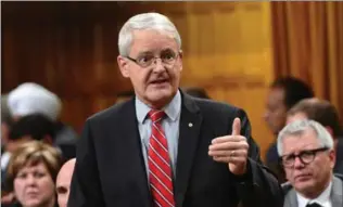  ?? SEAN KILPATRICK, THE CANADIAN PRESS ?? Transport Minister Marc Garneau will be part of a delegation heading to Paris to plead Canada’s case for keeping the World Anti-Doping Agency headquarte­rs in Montreal.