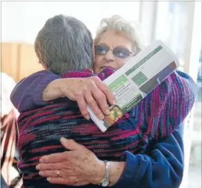  ?? Photo: IAIN MCGREGOR/FAIRFAX NZ ?? Joy Rogers, left, embraces Nancy Jordan at a meeting of former retirement villagers and Labour MPLianne Dalziel in Christchur­ch yesterday.