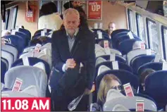  ??  ?? Spotted: Mr Corbyn walks past more empty seats, which Virgin says were reserved, but only for later in the journey 11.08 AM