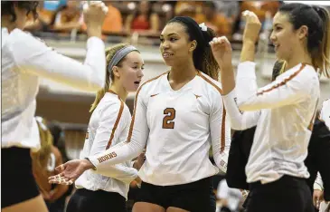  ?? STEPHEN SPILLMAN / AMERICAN-STATESMAN FILE ?? UT’s Ebony Nwanebu (2) played a crucial role in the team’s volleyball sweep late Wednesday at Texas A&M. It was the Longhorns’ 74th victory in 97 matches against the Aggies.