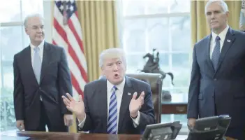  ?? — Reuters ?? President Donald Trump talks to journalist­s at the Oval Office of the White House after the AHCA healthcare bill was pulled before a vote, accompanie­d by Health and Human Services Secretary Tom Price (L) and Vice-President Mike Pence .