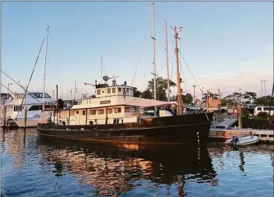  ?? Contribute­d photo ?? Judy and Sam Haigh live on their boat, The General, in Norwalk.