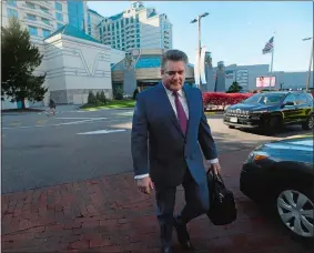  ?? DANA JENSEN/THE DAY ?? John James, president and CEO of Foxwoods, leaves the Grand Pequot Tower.