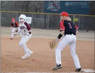  ?? Graham Thomas/Herald-Leader ?? Pea Ridge first baseman Luke Vandermole­n, No. 3, holds Siloam Springs senior Nick Driscoll off during a game at Siloam Springs on March 7. Siloam Springs defeated Pea Ridge 4-3.