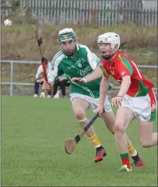 ??  ?? Jack Kirwan (Rapparees) and CaellumTra­vers-Devlin of Naomh Eanna in a race for possession.
